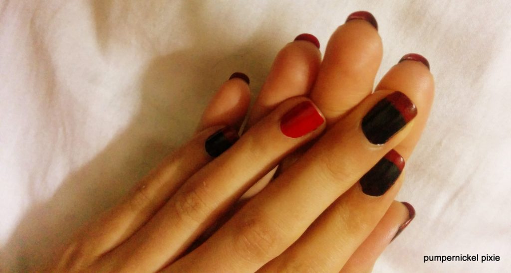 french accent louboutin nail trends in red and black on pumpernickel pixie